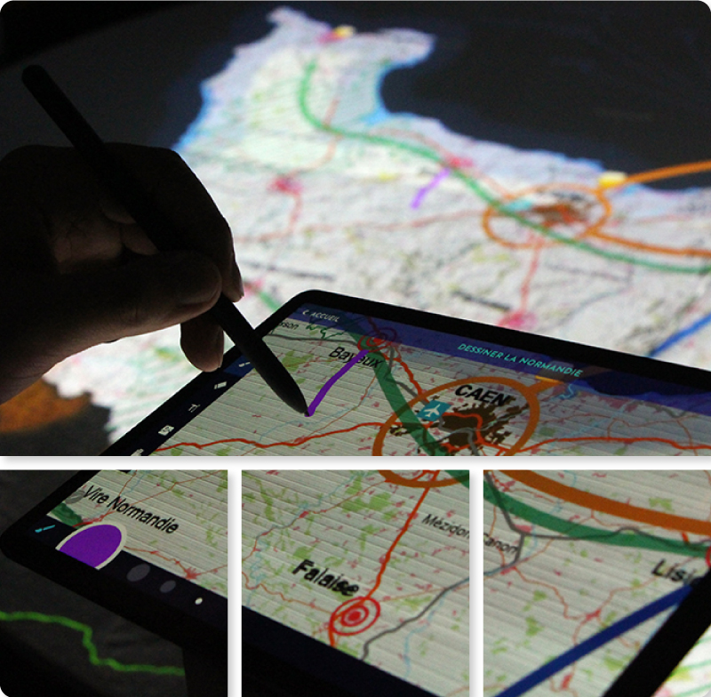 Un utilisateur dessine en direct sur la maquette NormanDisplay à l'aide de la tablette interactive.
